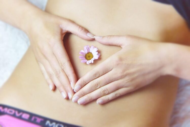 stomach acid and digestion woman with flower