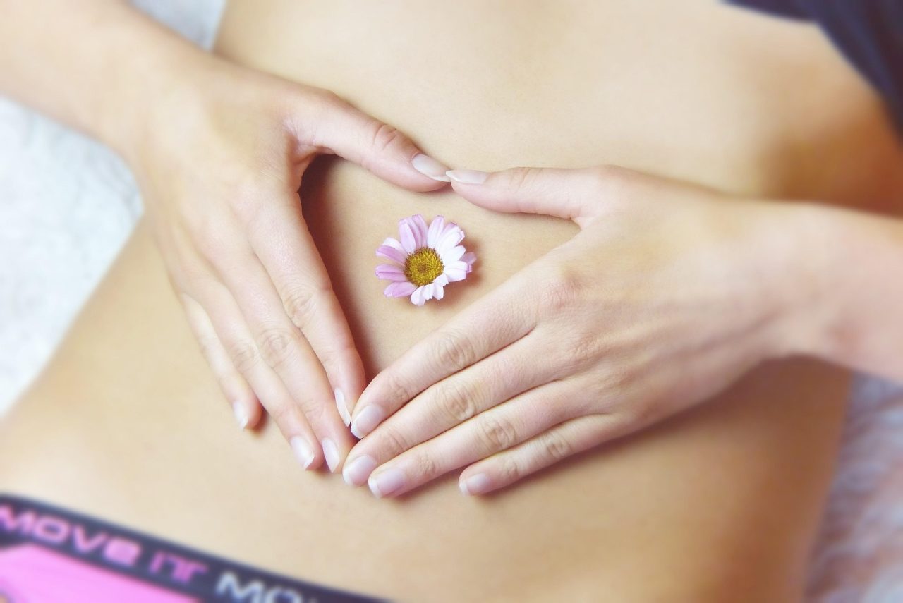 stomach acid and digestion woman with flower